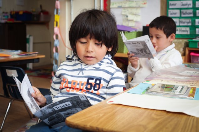 Two students reading 