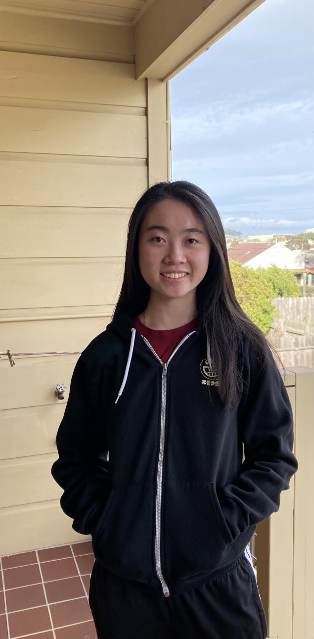 Smiling asian woman with long brown hair