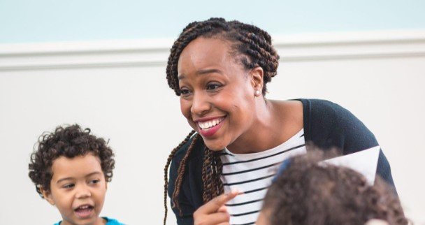 Female teacher with young students