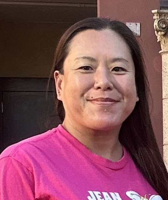 Smiling asian woman with long brown hair