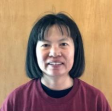 Smiling Asian woman with shoulder length hair