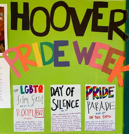 Pride week display board with information on LGBTQ activities.