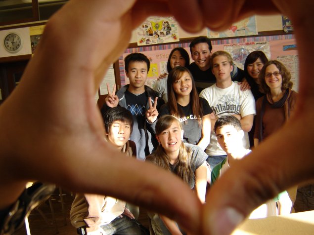 A group of middle school students with their teacher
