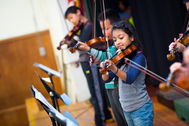 Students playing musical instruments