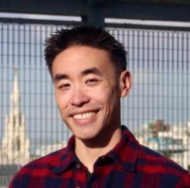 Smiling Asian man with short hair