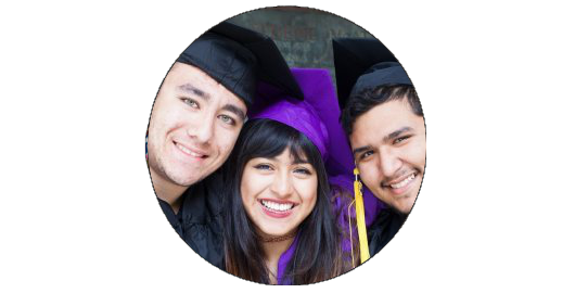 three high school students smiling in graduation gowns 