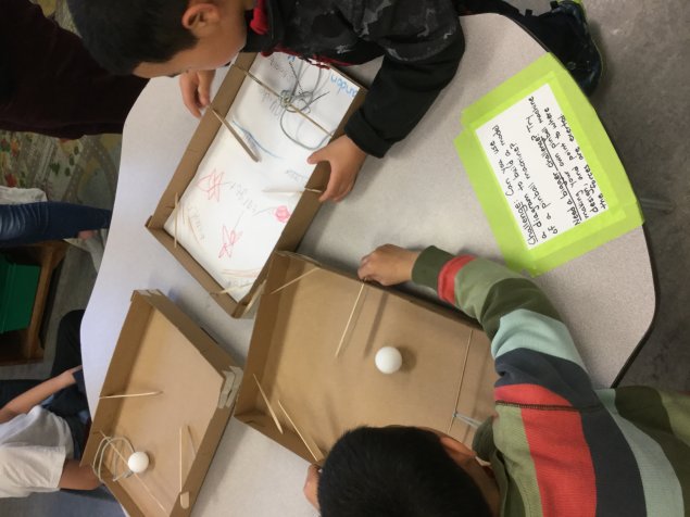 Students experiment with pinball science. link to elementary science curriculum