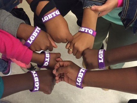 Students wearing LGBTQ wristbands